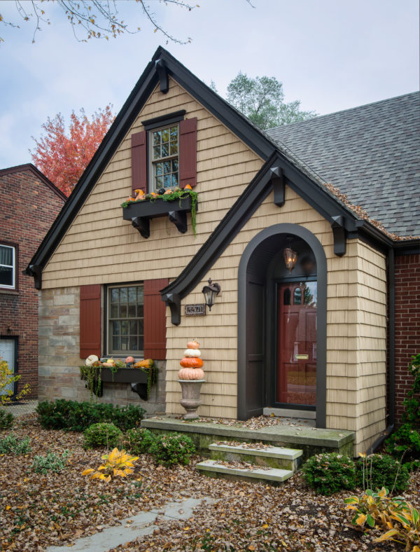 charming cottage style with pella tan front door color and beige siding exterior