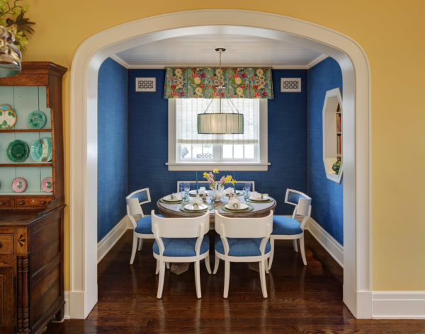 contrast royal blue with amber yellow walls for a classic kitchen and dining room