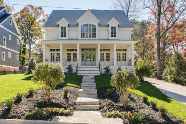 country house looking classically charming with a sky blue front door color