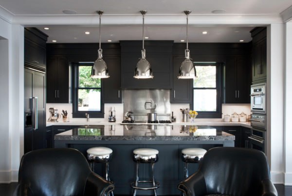 evoke some drama with black furniture contrasting white walls and stainless appliances