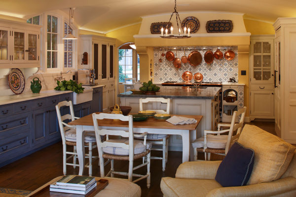 traditional and cozy french provincial kitchen fuses royal blue furniture and yellow paint