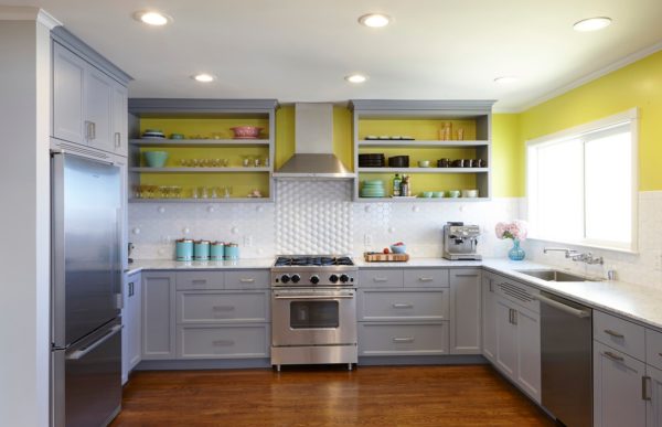 u-shaped kitchen with chartreuse backsplash and turquoise accessories