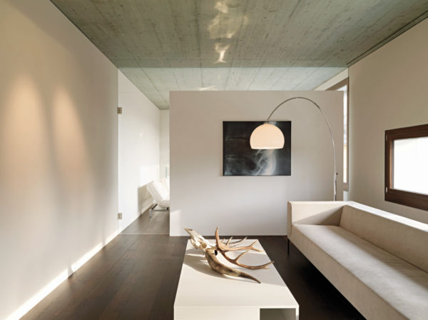 simple white half wall to divide the room in a modern and minimalist home