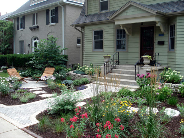 try the idea to pair concrete steps with ornamental perennial for a beautiful front exterior design