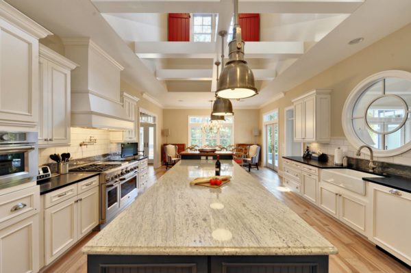 kashmir white granite – contemporary kitchen island basked in warmth and natural marble