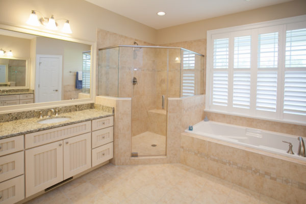 medallion white chocolate with mocha highlights – timeless master bathroom design featuring travertine tile floors