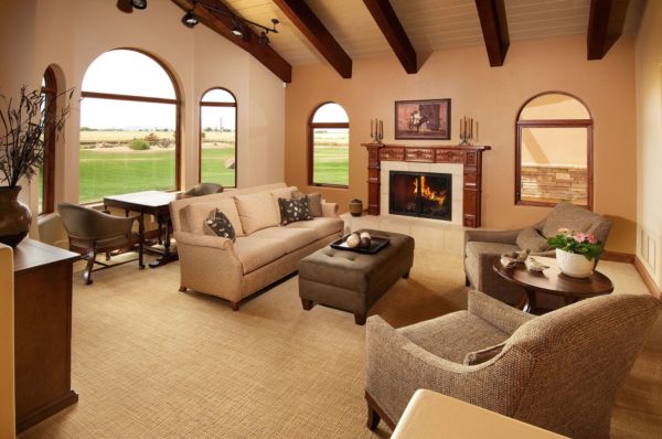 tatami tan from sherwin williams – cozy living room with earthy tones and warm fireplace