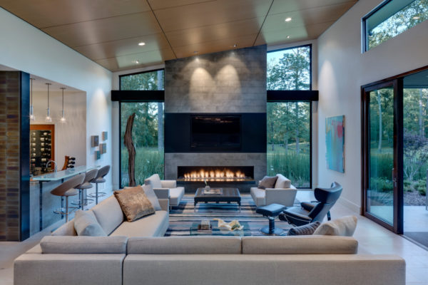 build a modern and luxury nest featuring lagos blue stone in the linear fireplace and ebony veneer for the tv surround