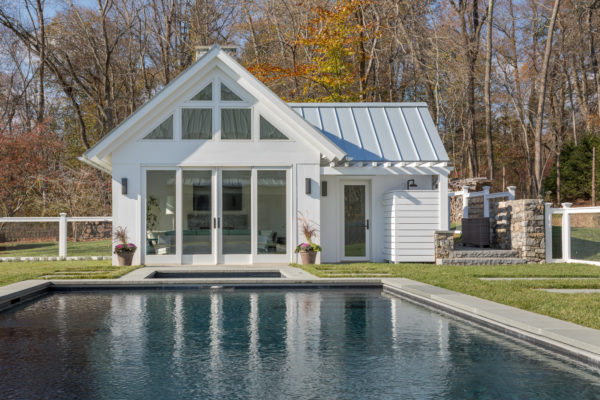 build an all-white pool house with bathroom and second living room for the ultimate pool experience