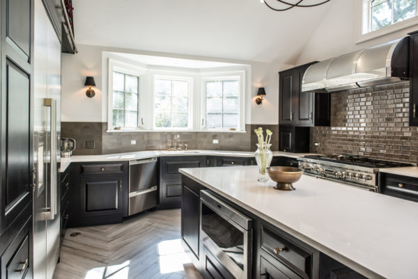 choose a luxurious kitchen featuring maple wood, quartz, onyx finish, and a bright bay window over the sink