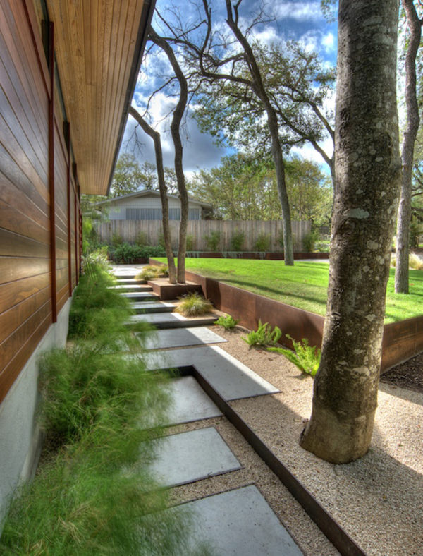 complement your wood siding with some corten steel retaining wall and concrete pad steppingstones