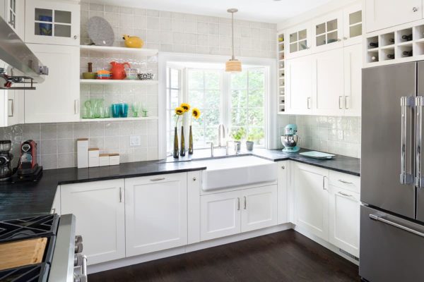 large bay window over sink in an all-white kitchen for a bright and modern atmosphere