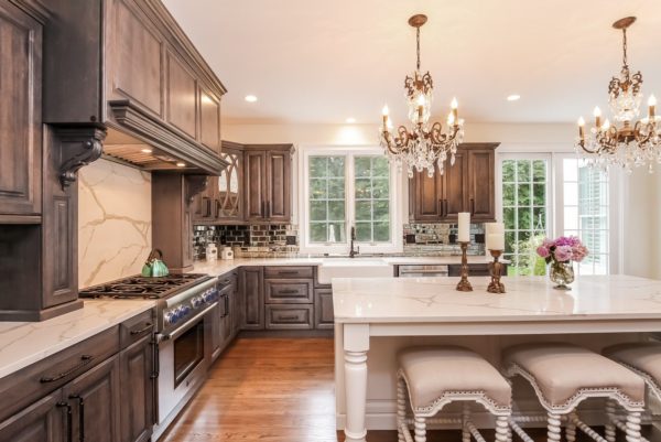 splurge on glass chandeliers and marble countertops to complement your grey-stained cabinets for a classy kitchen