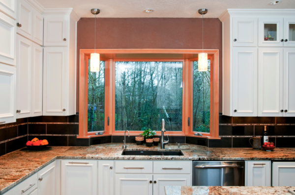 try a 6-feet wooden bay window along with a traditional u-shaped kitchen setup