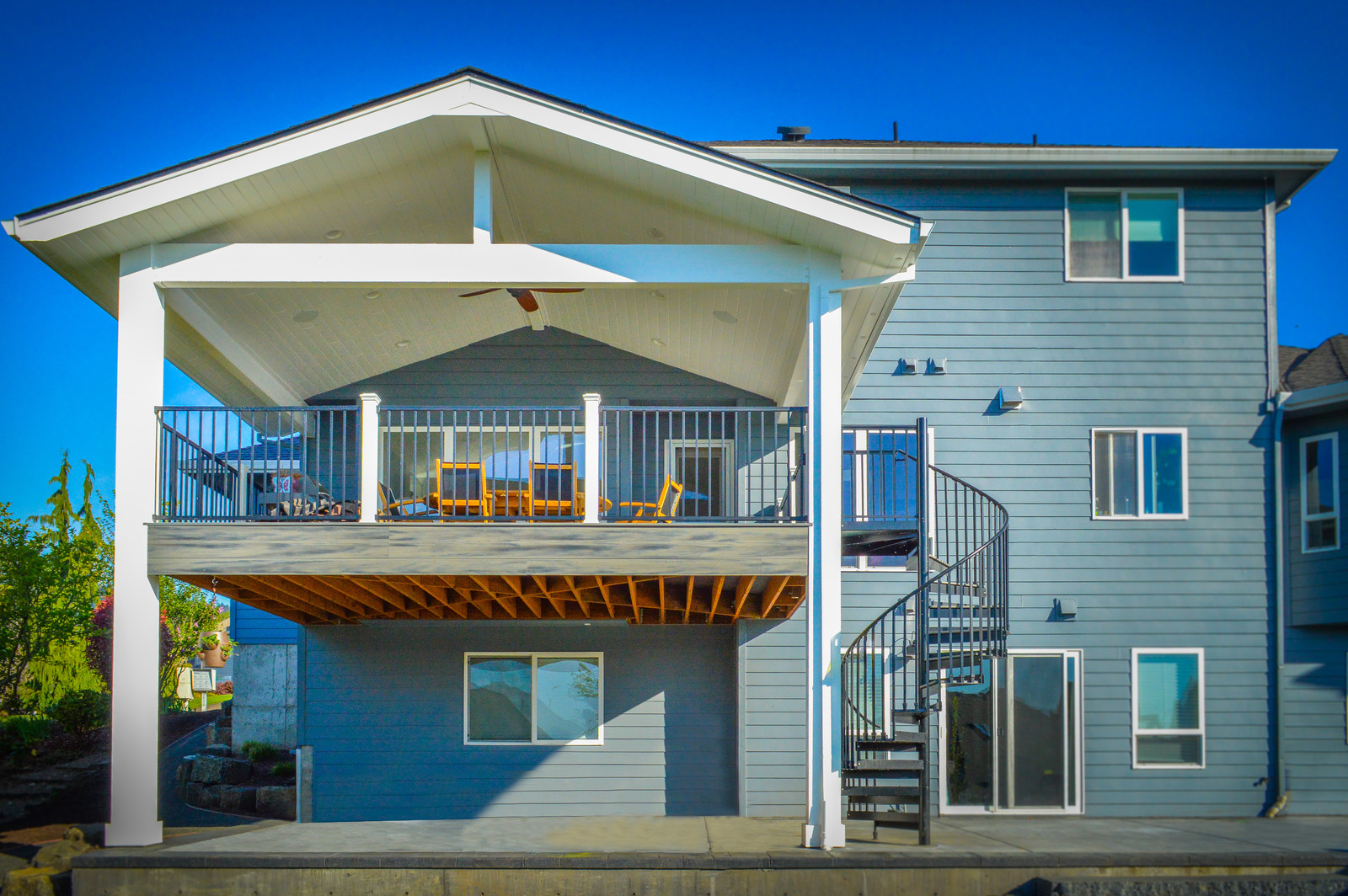 Second Floor Porch Ideas Viewfloor Co   A Stylish Second Story Deck With Spiral Staircase And Cozy Setup For Bbq And Outdoor Dinners 