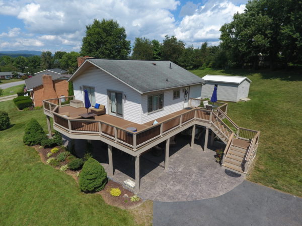 go for a wrap-around second-story deck with vinyl railing for a spacious entertainment area