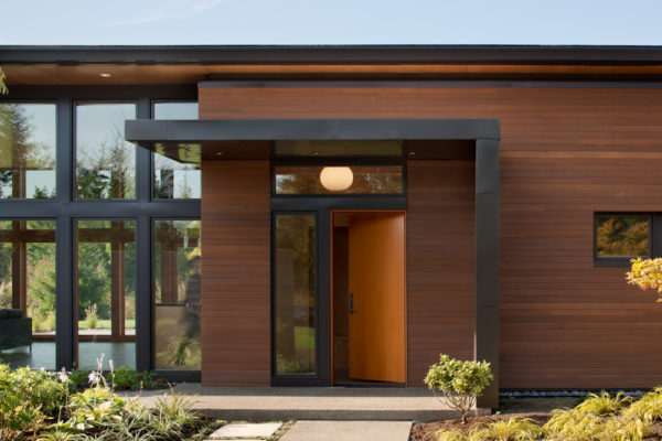 try a modern entry with roof over the door to embody beachside contemporary home design