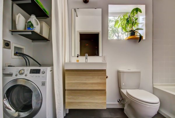 use white curtains to conceal laundry nook and shelves in your modern bathroom design