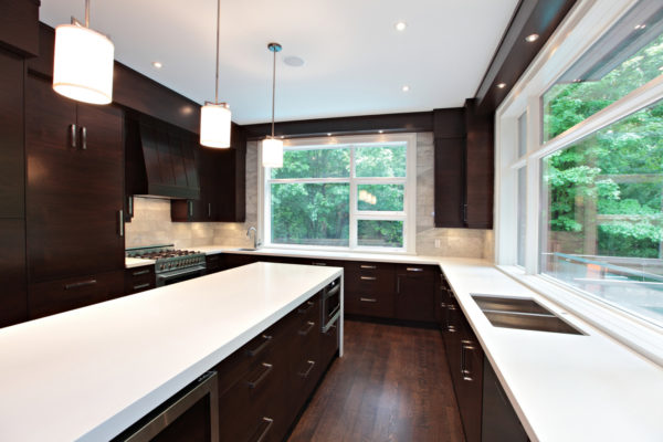 go for a contemporary look with light brown backsplash and glossy white countertops