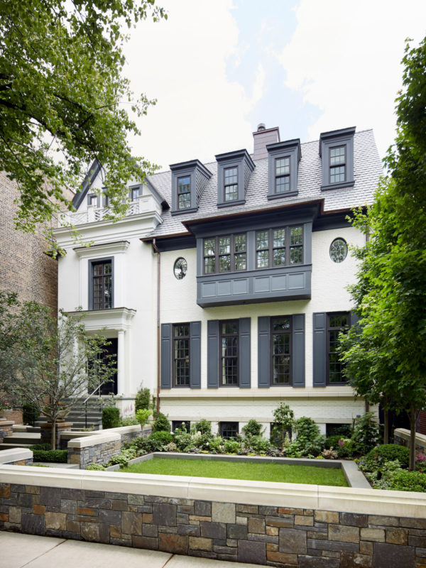 go for a dark shutter color to juxtapose the white exterior and create a stunning urban house