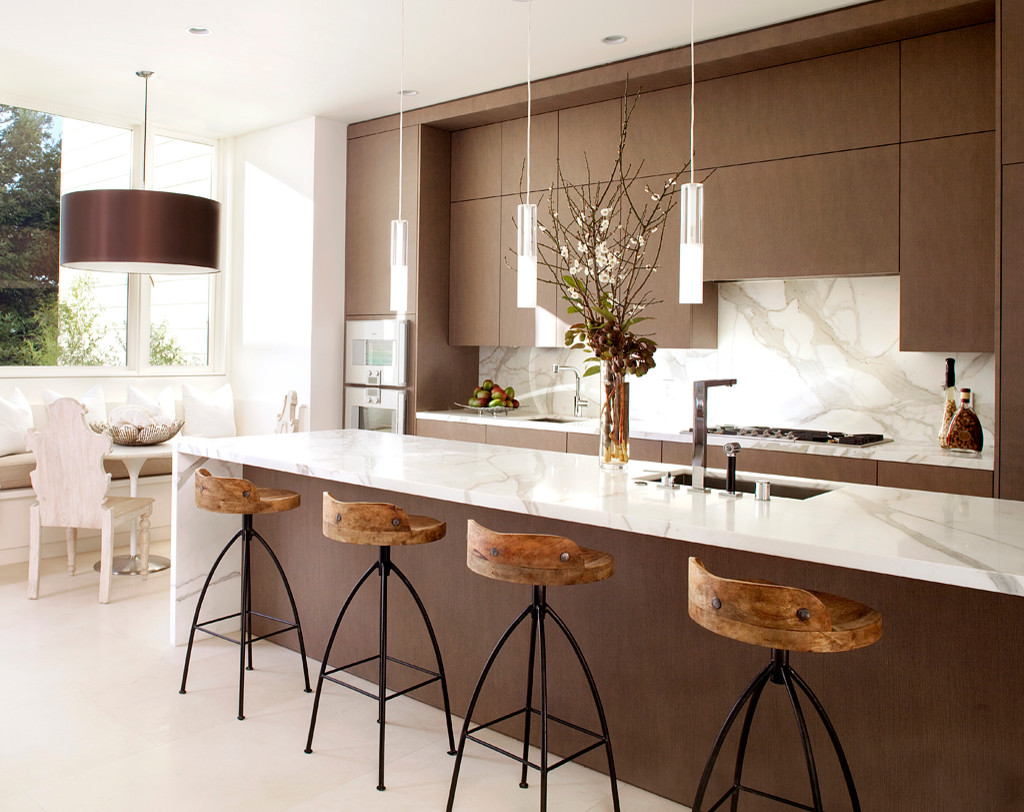 white kitchen with brown floors dining table