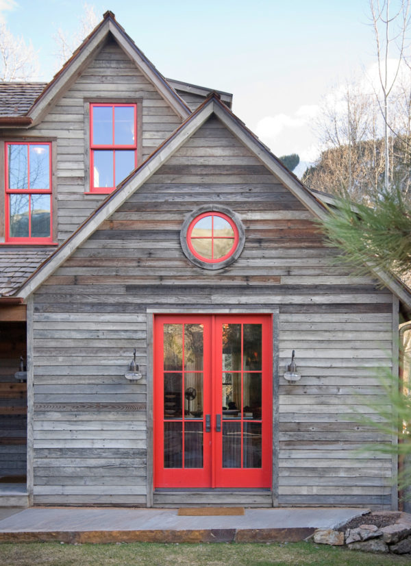 pair trendy red doors with reclaimed lumber exterior for a rustic retreat style house