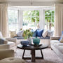 complete an elegant formal living room with bay window seating and multicolored pillows