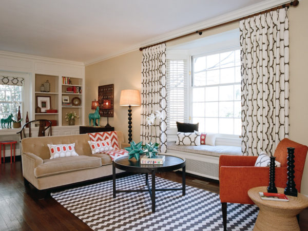 mix different textiles and patterns to create a unique contemporary living room with bay window
