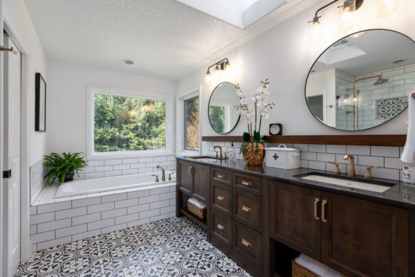 use subway tile with black grout as bathtub surround in an eclectic bathroom fusing modern and traditional features