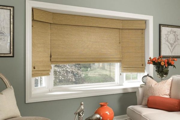 woven wood shades is the perfect accessory for a bay window in contemporary living room