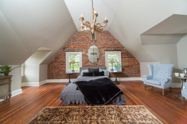 a simple attic bedroom with exposed brick wall encapsulates the best of tudor style house interior