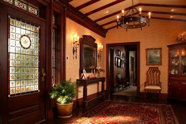 create a traditional entryway in a tudor style house interior for an inviting vibe