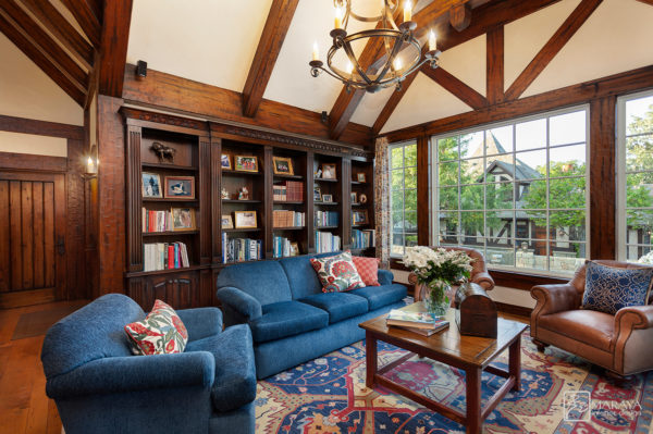 this tudor style house interior is influenced by farmhouse features to create a cozy library