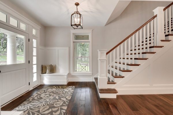 a foyer entry featuring bm edgecomb gray walls and dove white trim can look timeless with a glass-covered door