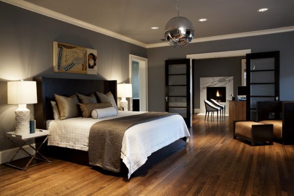 a gorgeous craftsman bedroom features sw7674 peppercorn gray walls, white trim, and black accents for a modern ambiance