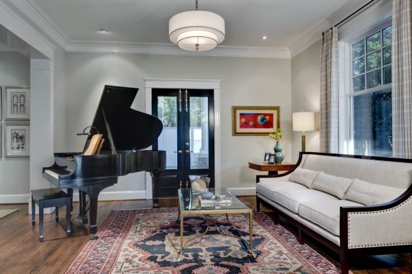 a rustic rug and grand piano to jazz up this living room with sw 7029 agreeable gray walls and sherwin williams 7005 pure white trim