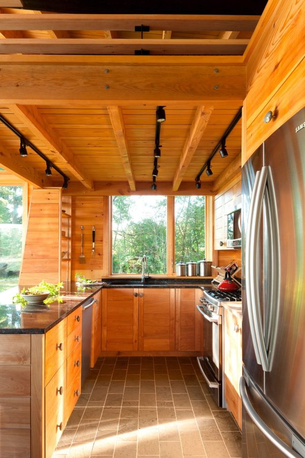 consider this mountain style small kitchen with a peninsula that is rustic, homey, and stylish