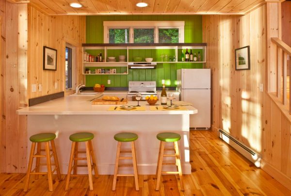 let the rustic style dominate your small kitchen with a peninsula and pair it with popping green accents