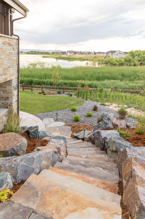 try this craftsman landscaping slopes with rugged rocks for a nature-inspired staircase