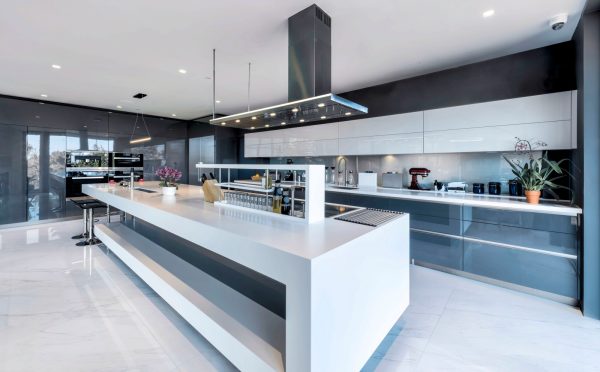 choose an ultra-modern kitchen featuring white tile kitchen floor and flat panel cabinets