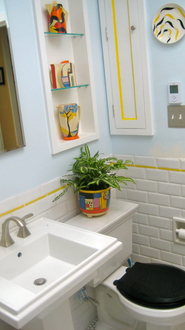consider a classic style bathroom featuring a tiny recessed wall cabinet between studs