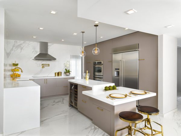 gold accents can elevate any kitchen space with a white tile floor for a luxurious finish