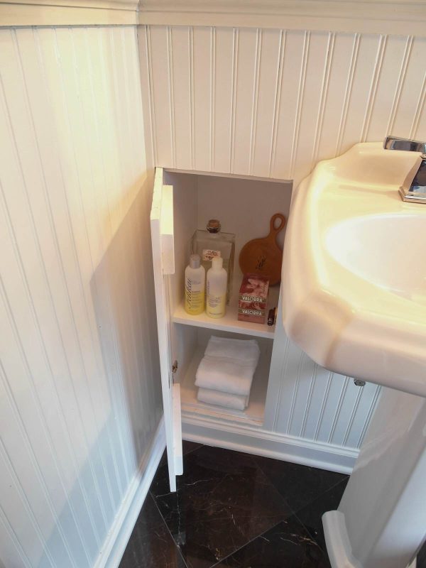 this recessed wall cabinet between studs in the bathroom can hide toiletry