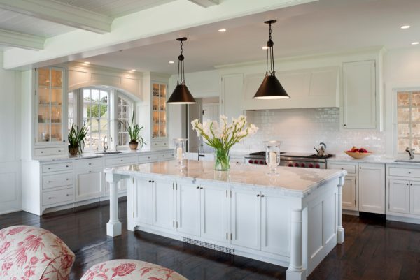 try benjamin moore dove white cabinets and white calcutta marble countertops on a dark wood flooring for a lovely kitchen
