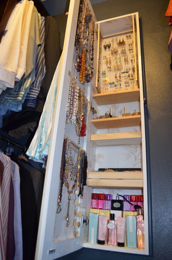 use a recessed wall cabinet between studs to store jewelry for a clutter-less closet