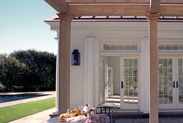 build a timeless patio that features lovely white french doors with transom and subtle greek architecture