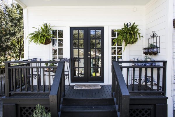 complement benjamin moore’s black doors with benjamin moore cotton balls white trim for a traditional porch