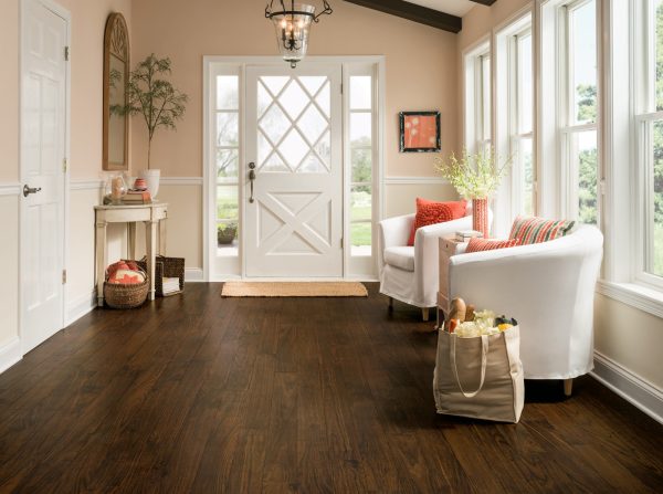 convey a subtle feminine air with orange walls and brown floor that complements the white front door