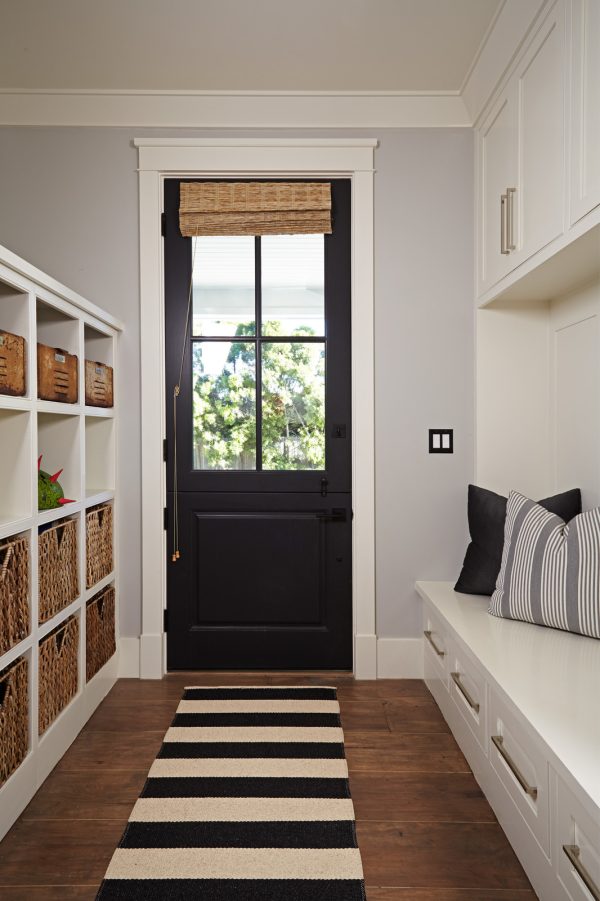 create a narrow but welcoming entryway with soft black doors (farrow & ball’s railings) and crisp white trim