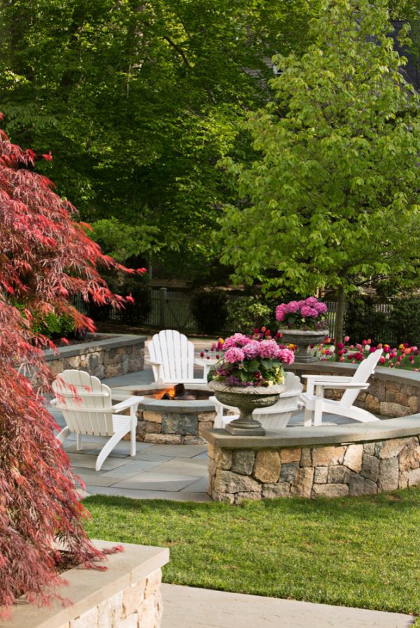 go with pennsylvania bluestone for your retaining wall cap and flooring makes for a traditional patio idea